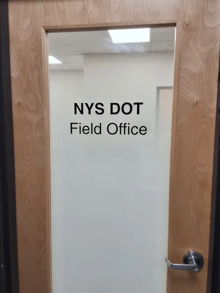 Vinyl lettering on a frosted glass door by Marv'les Signs