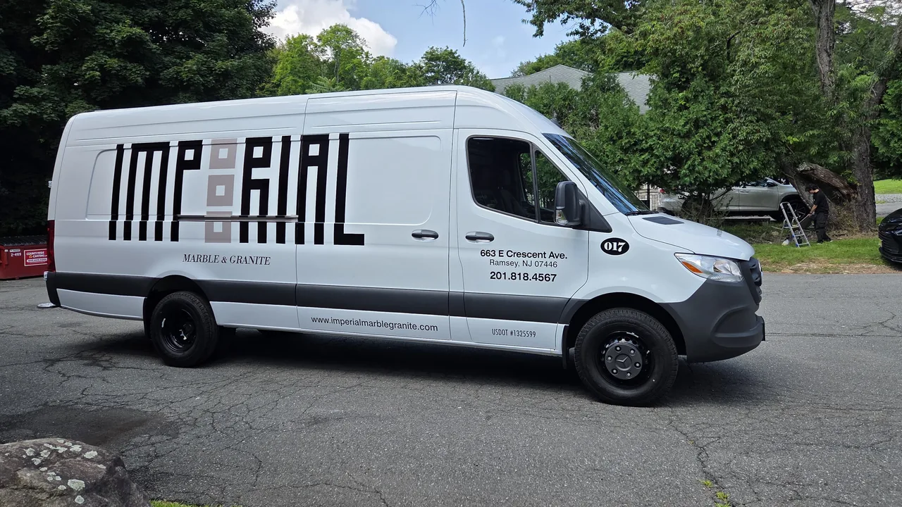Vehicle lettering on an Imperial Marble & Granite van by Marv'les Signs