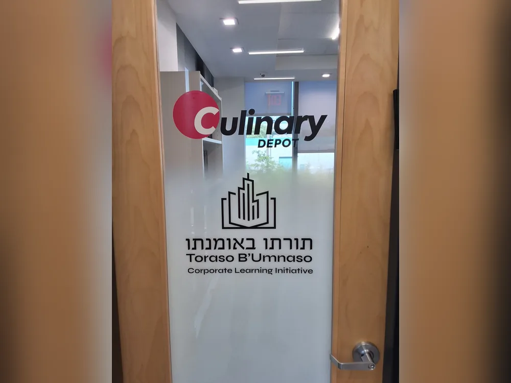 Logo vinyl on a frosted glass office door by Marv'les Signs