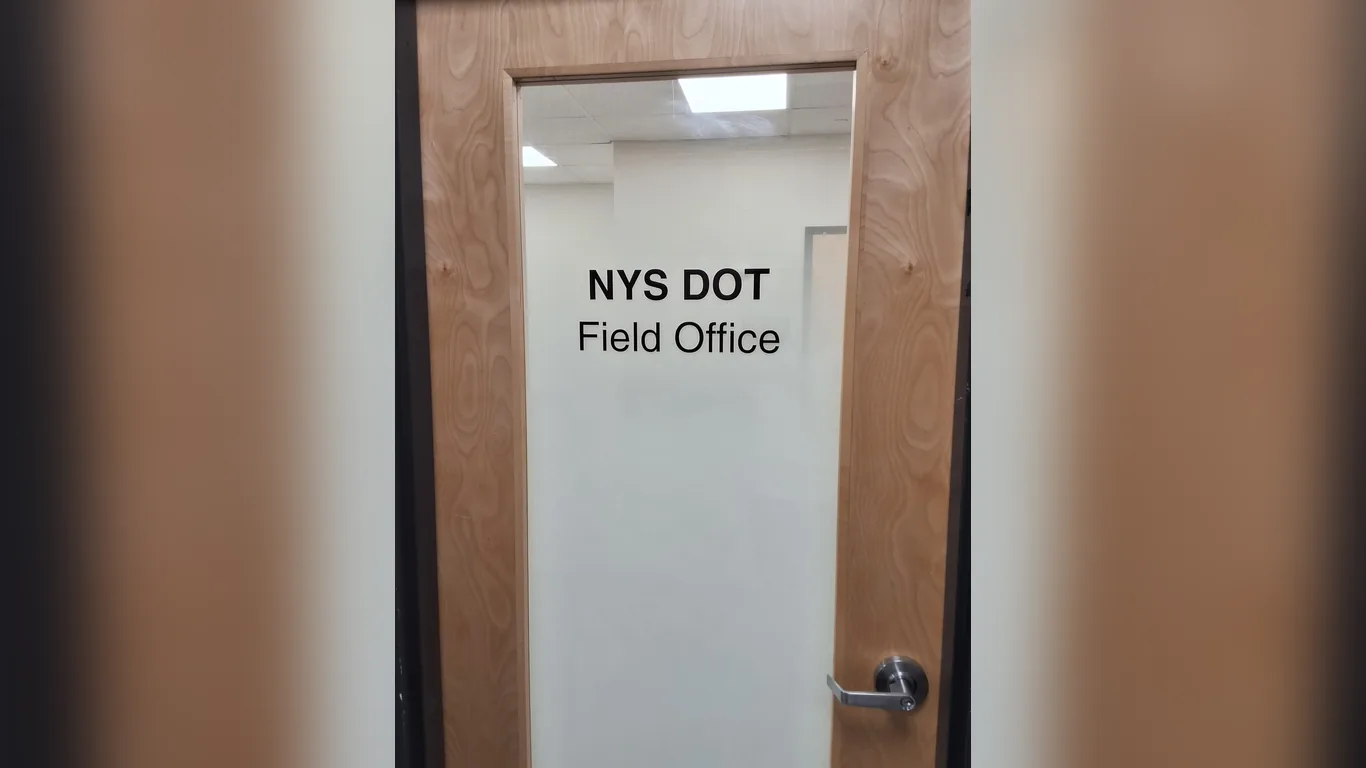Vinyl lettering on a frosted glass door by Marv'les Signs